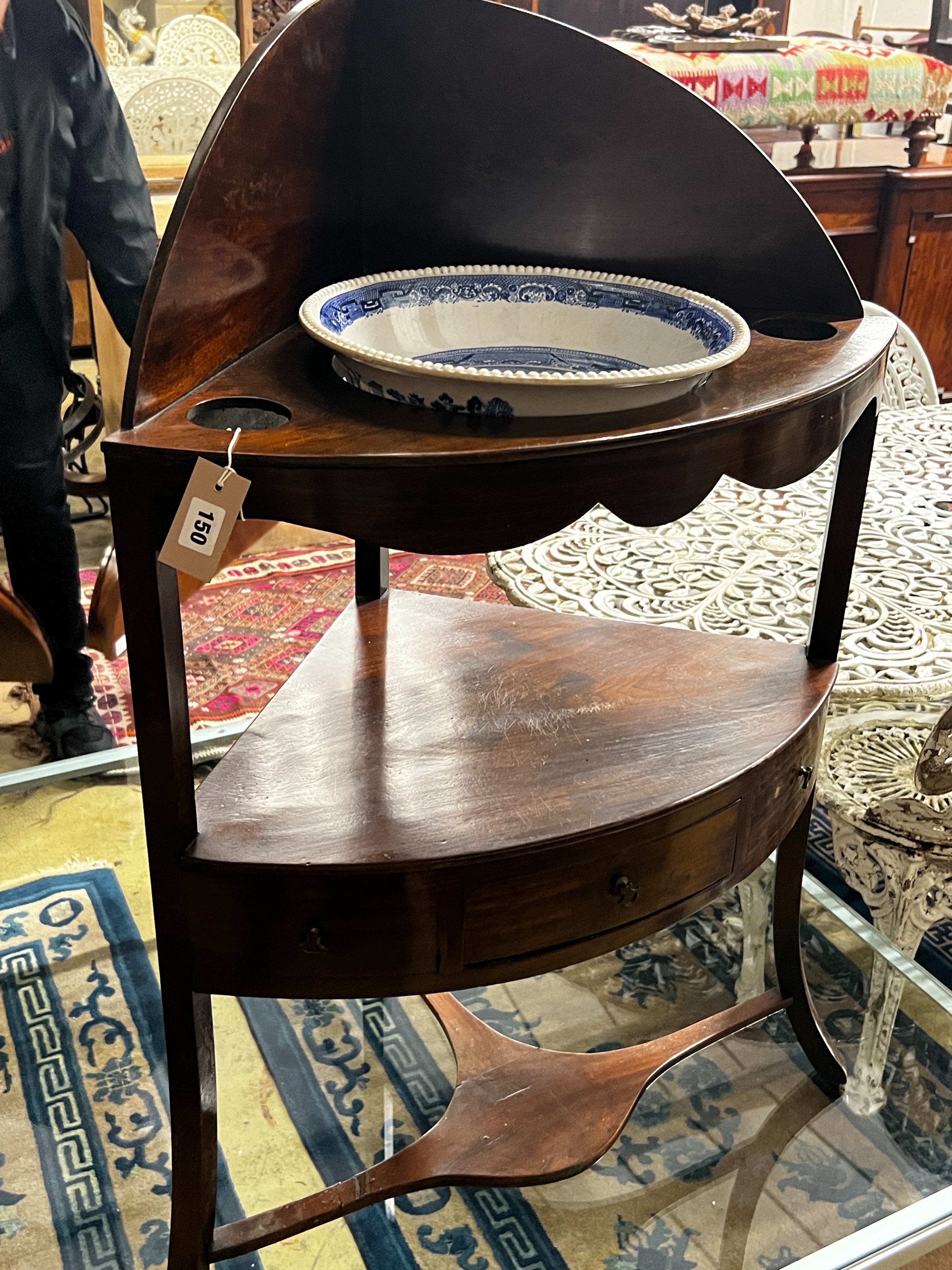 A George III mahogany bowfront corner washstand